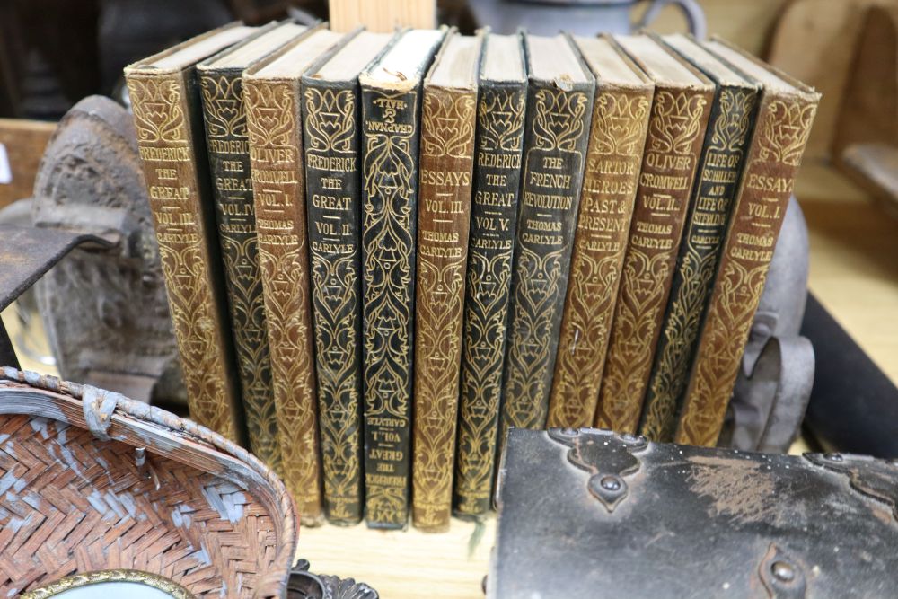 Assorted decorative objects including metalware, books, etc.